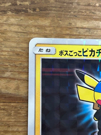 Promo Pokemon card featuring Boss Garbed Pikachu Aqua Squad from Sun & Moon series with minor scratch