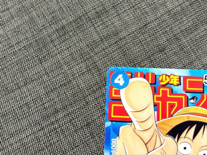 One Piece Monkey D. Luffy P-033 collectible card with 25th anniversary illustration and Hit attribute
