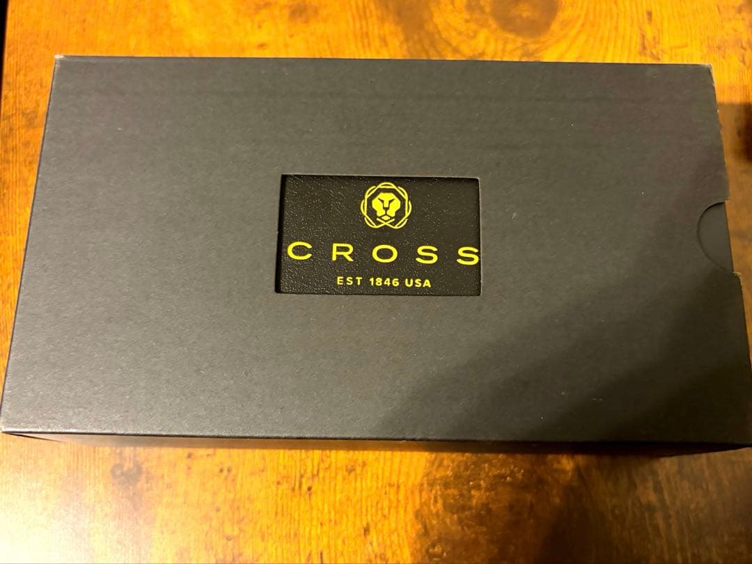 Cross Century II ballpoint pen with navy blue body and gold accents on a white background