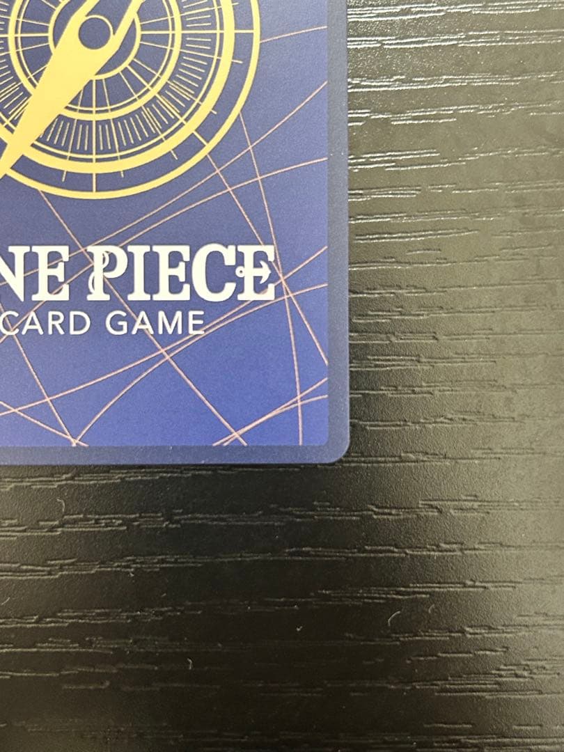 One Piece Kamusari R Parallel OP10-019 Shanks collectible trading card in protective sleeve