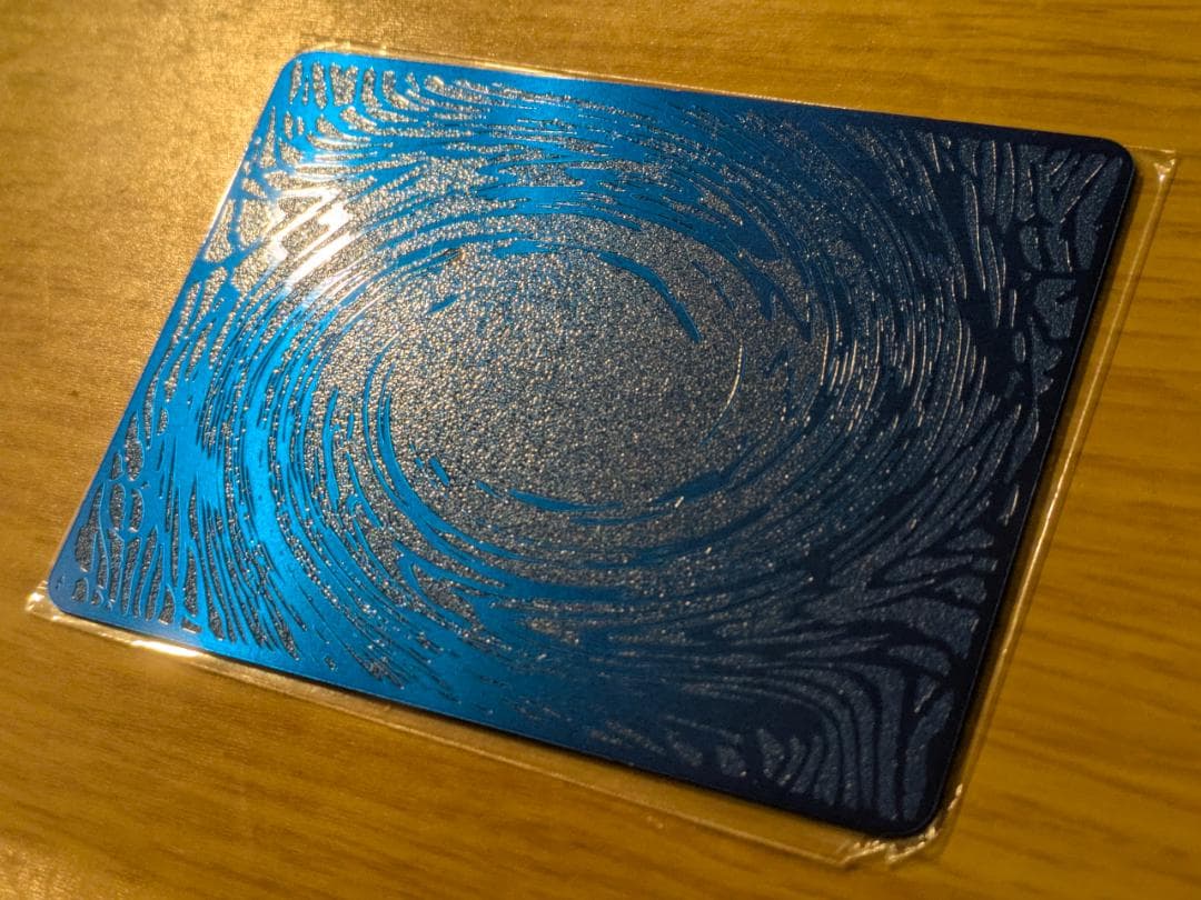 Yugioh Book of Eclipse stainless steel field center card measuring 62 by 89 mm weighing 20 grams