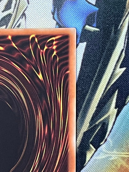 Black Magician Girl 20th Anniversary trading card with scratches and white flecks visible