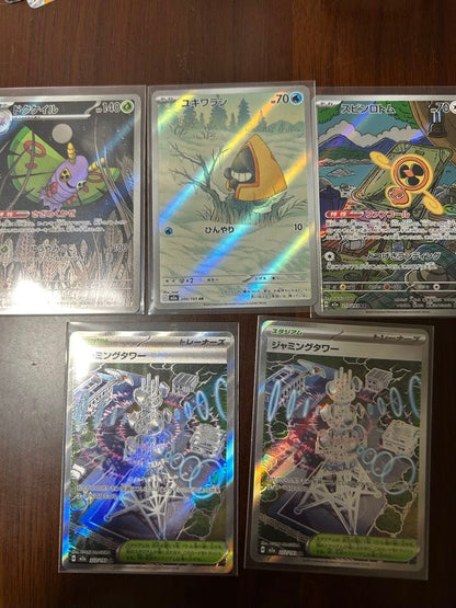 Bandai Pokemon card collection including Mega Charizard X ex MA, Mega Lucario ex MA, and rare AR cards