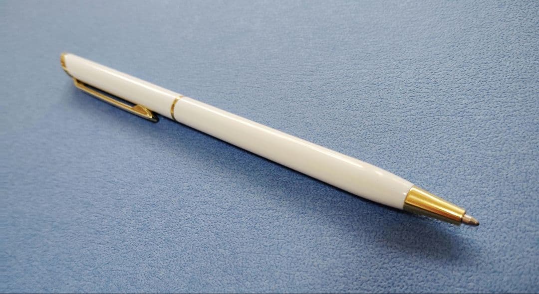 Sheaffer 100 Year fountain pen with red body, silver hairline stainless steel cap, white dot clip, and F nib