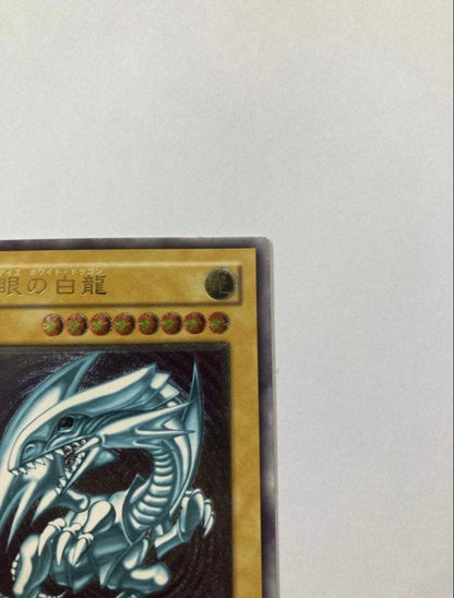 Blue-Eyes White Dragon SM-51 used relief artwork from Yu-Gi-Oh series in good condition