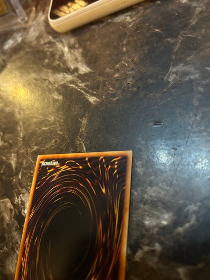 Yugi-Oh Early Ultra Rare Red Eyes Black Dragon playing card from OCG with minor wear and scratches