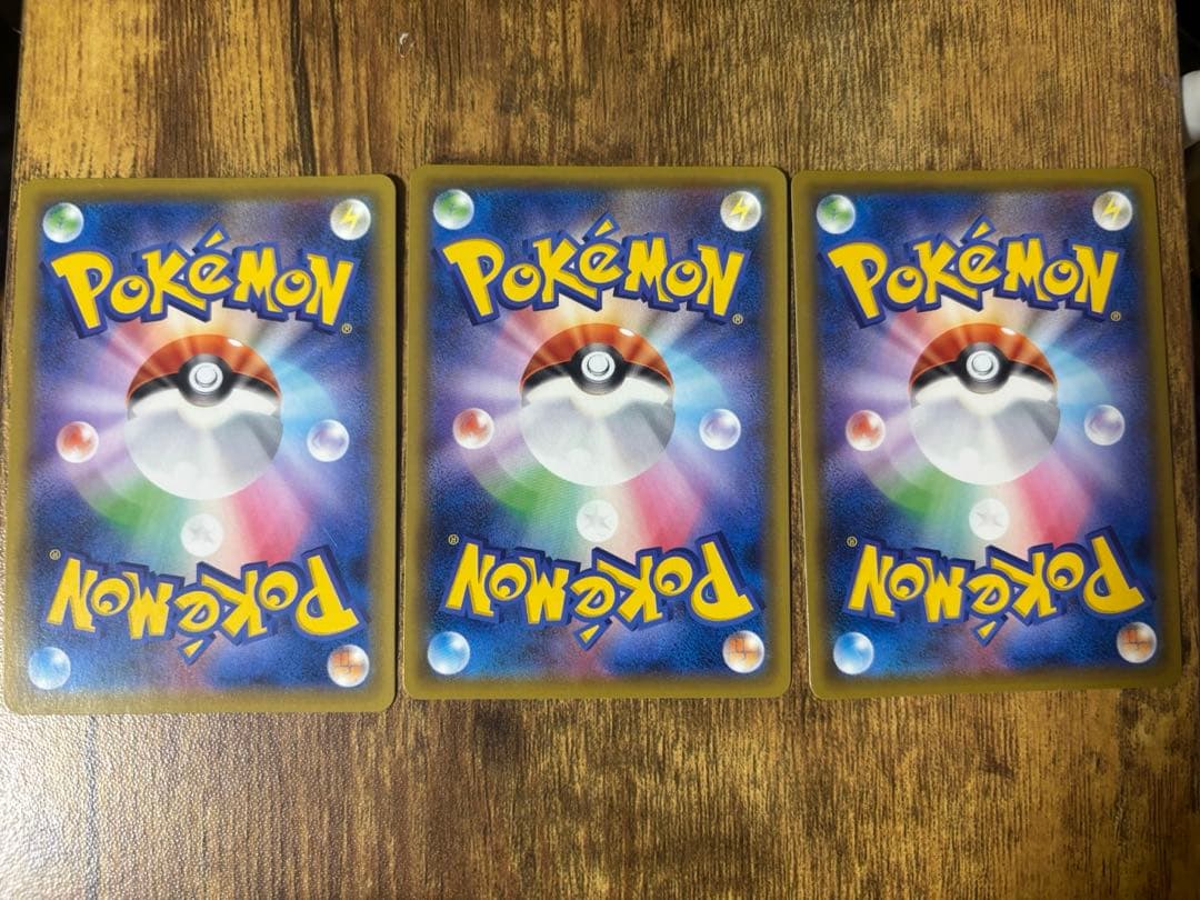 Three Pokemon Center Elder Sister SR Mugen Zone trading cards in sleeves and loaders
