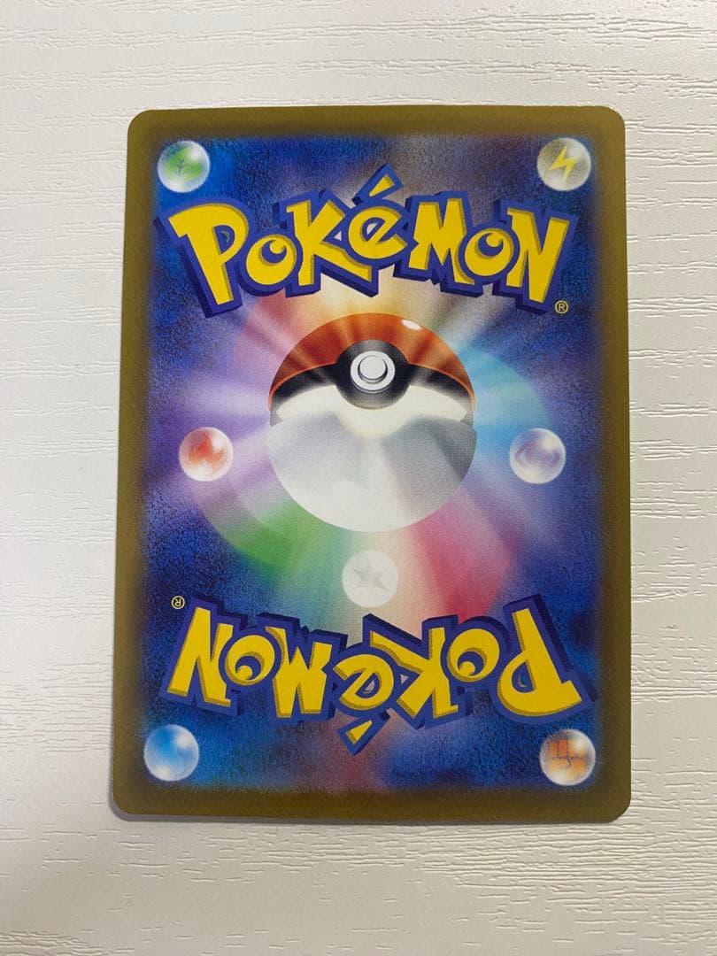 Japanese card sleeves with card loader stored for protection, showing surface marks from storage
