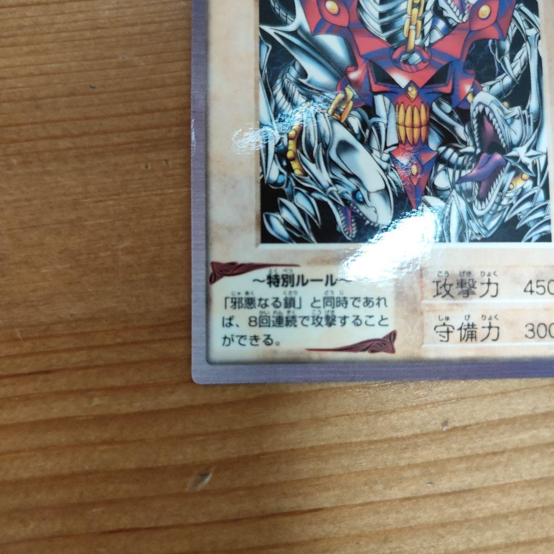 Bandai Yu-Gi-Oh! Blue-Eyes White Dragon three linked monster cards in storage sleeves showing minor wear