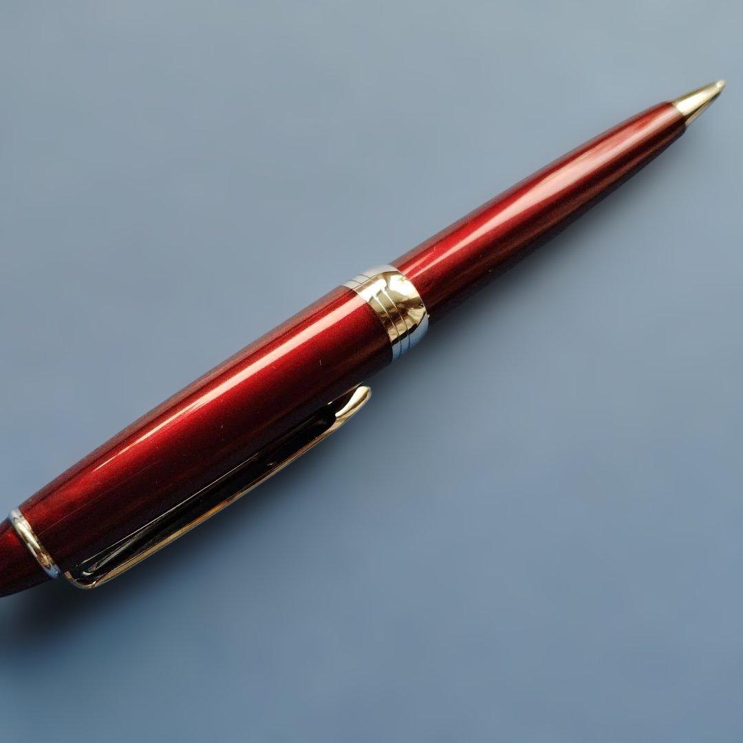 DAKS red ballpoint pen with silver clip and cap on white background metal body Japanese import