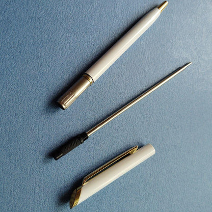DAKS red ballpoint pen with silver clip and cap on white background metal body Japanese import
