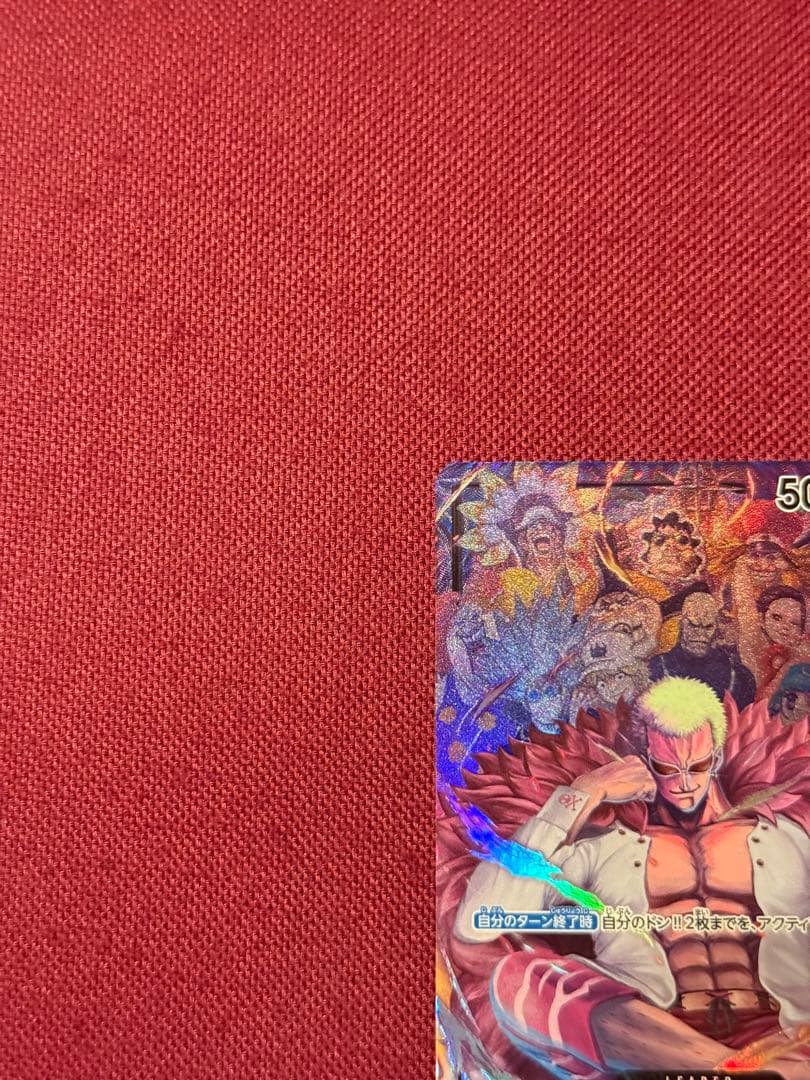 One Piece Donquixote Doflamingo OP04-019 trading card from Japan with minor signs of use in protective sleeve