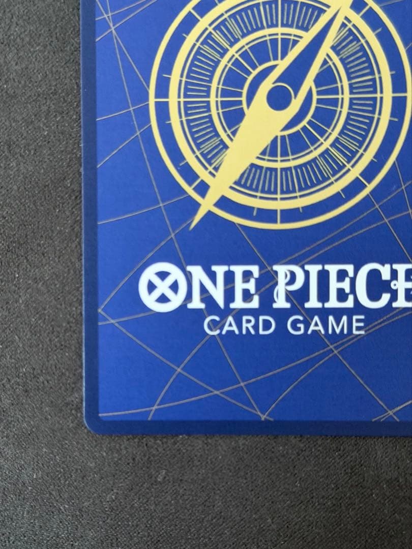 One Piece Monkey D. Luffy P-043 card game with visible vertical scratch marks on surface