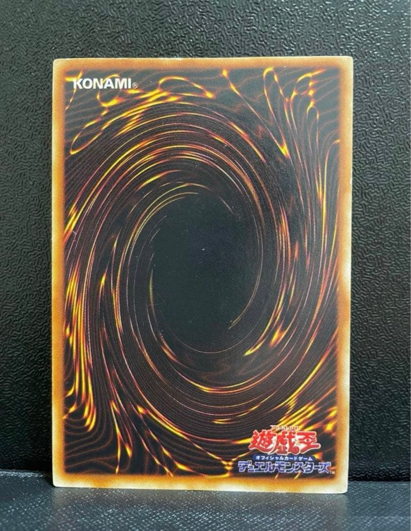 Yu-Gi-Oh Blue-Eyes White Dragon Initial Ultra Rare card in screw-down case with metallic border and slight scratches