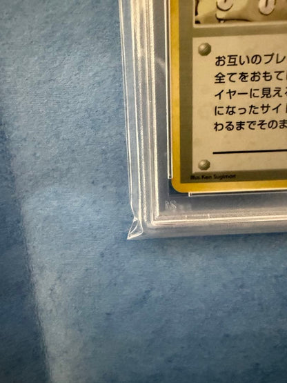 Bandai Rocket-dan Pokémon card with PSA 9 grade and old back design in protective case