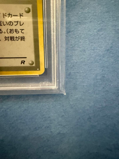 Bandai Rocket-dan Pokémon card with PSA 9 grade and old back design in protective case