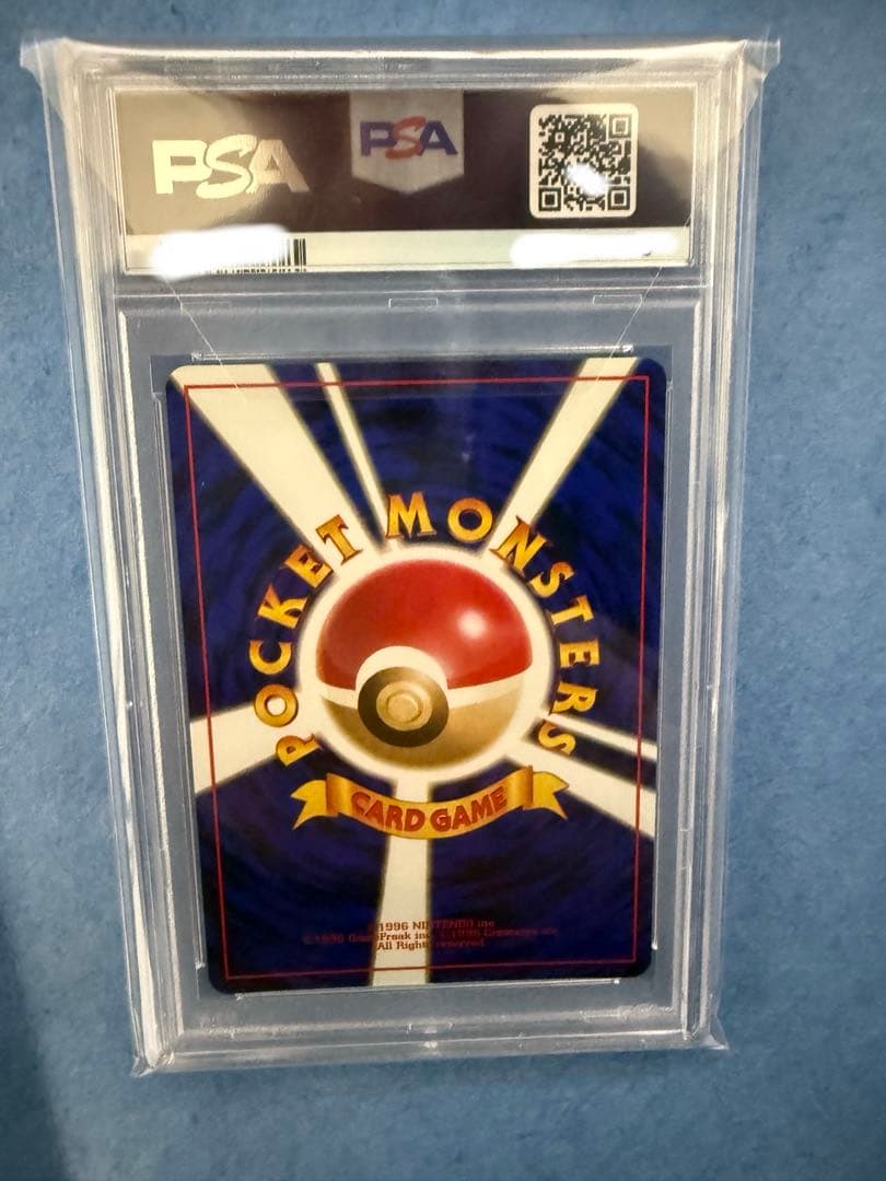 Bandai Rocket-dan Pokémon card with PSA 9 grade and old back design in protective case