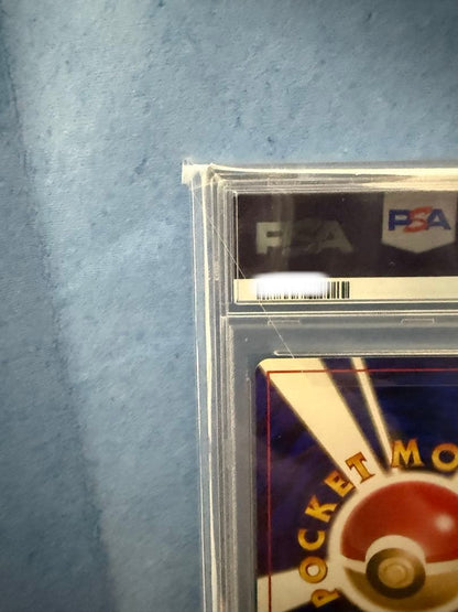 Bandai Rocket-dan Pokémon card with PSA 9 grade and old back design in protective case