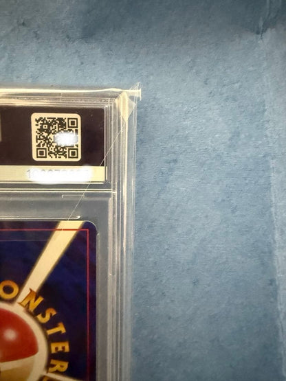 Bandai Rocket-dan Pokémon card with PSA 9 grade and old back design in protective case