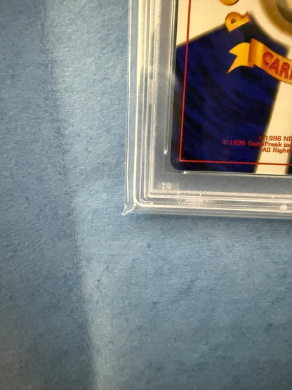 Bandai Rocket-dan Pokémon card with PSA 9 grade and old back design in protective case