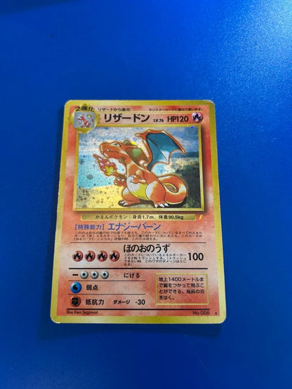 Vintage Japanese Pokemon Card Charizard LV 76 No 006 Energy Burn with visible wear and white spots