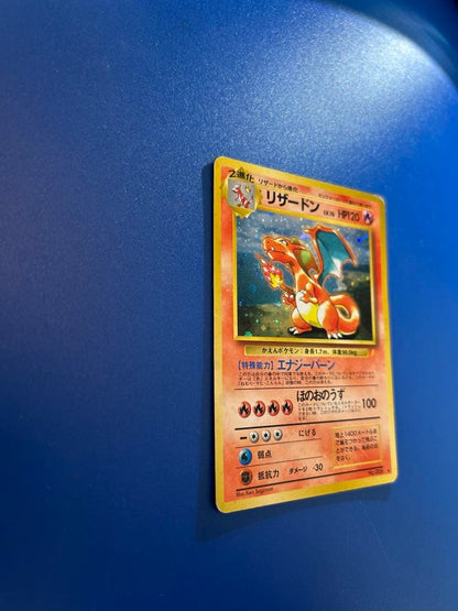 Vintage Japanese Pokemon Card Charizard LV 76 No 006 Energy Burn with visible wear and white spots