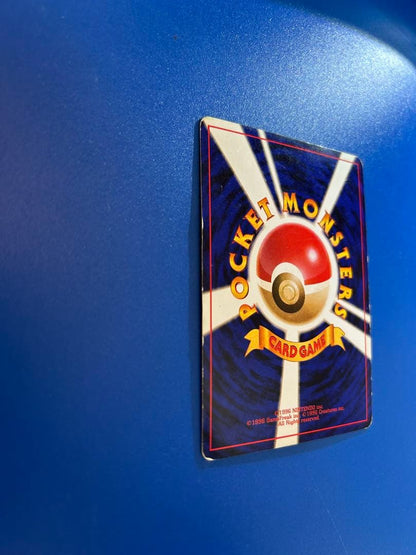 Vintage Japanese Pokemon Card Charizard LV 76 No 006 Energy Burn with visible wear and white spots