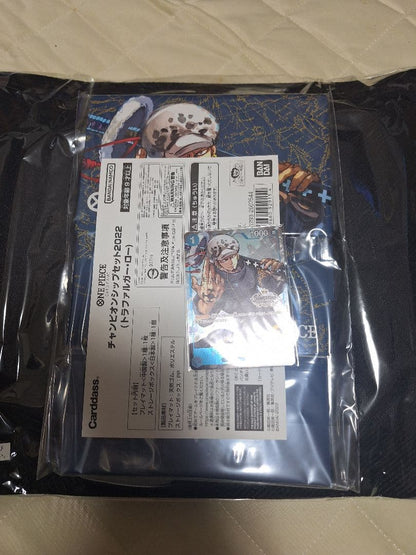 Bandai Namco One Piece Card Game Championship Set 2022 with Trafalgar Law card, playmat, and storage box