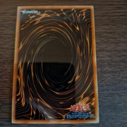 Bandai Blue-Eyes White Dragon stainless steel card holder with unopened loader showing Ultra Rare monster card