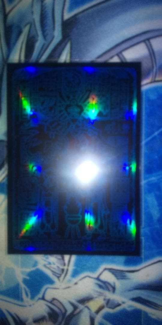 Bandai Blue-Eyes White Dragon stainless steel card holder with unopened loader showing Ultra Rare monster card