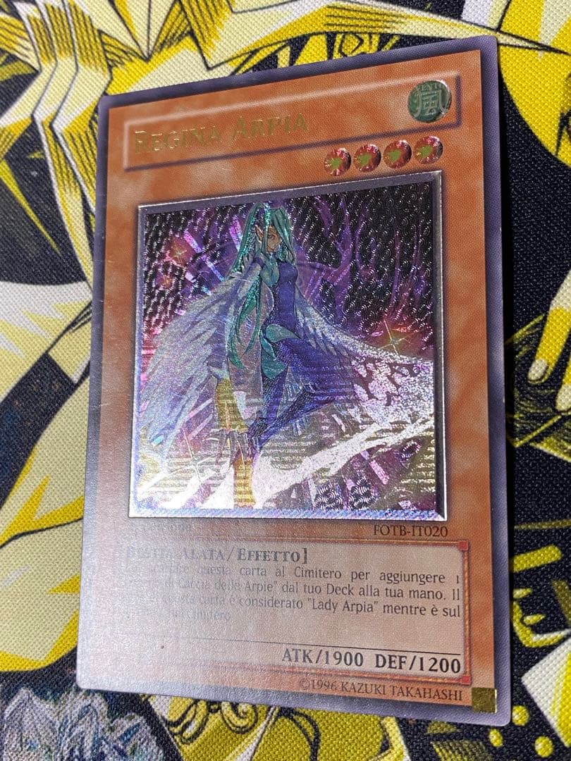 Yugioh Harpie Queen Italian First Edition relief card with visible scratches and scuffs