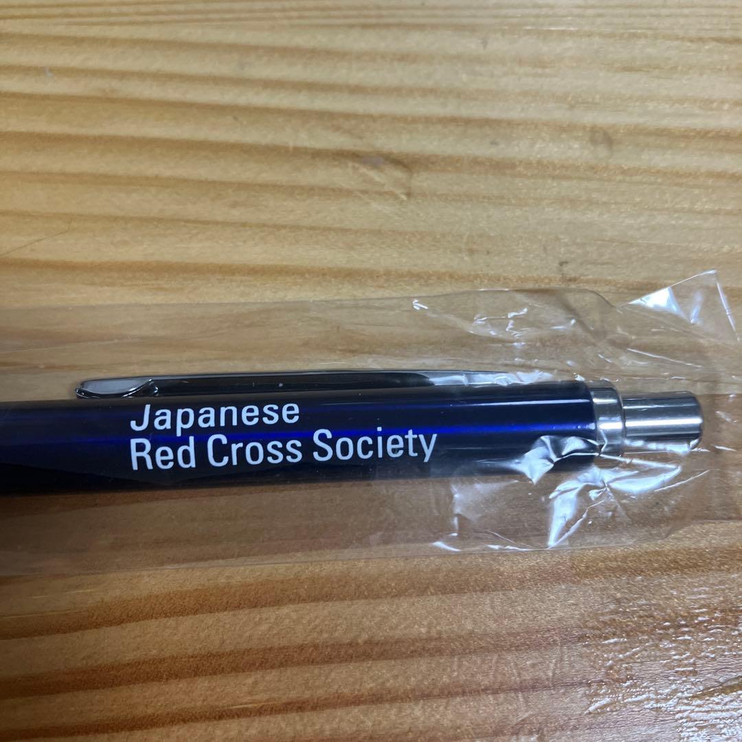 Navy blue Japanese Red Cross Society ballpoint pen with click mechanism and logo printed on barrel