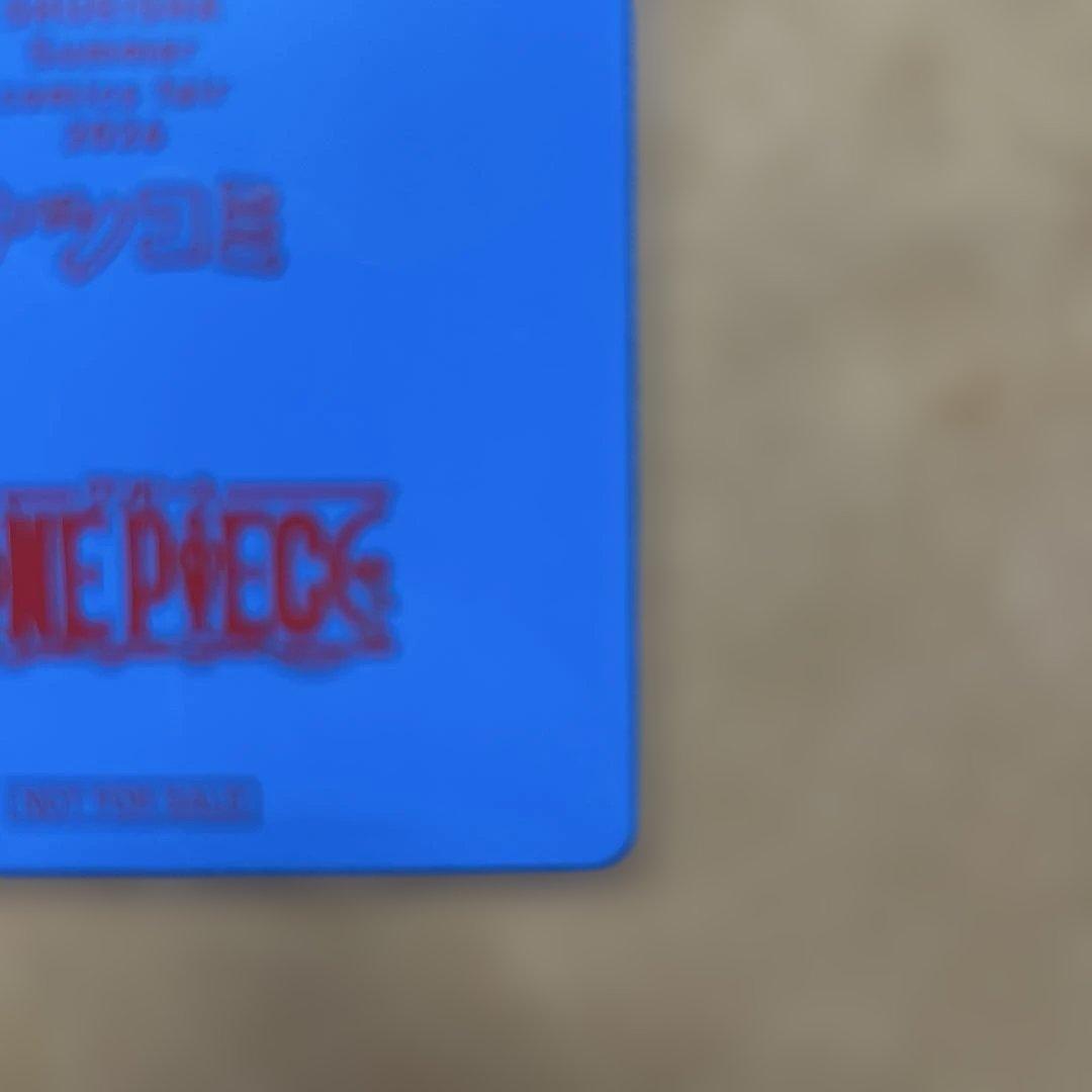 Oda Eiichiro signed One Piece Natsumi 2026 Metakira trading card in protective hard loader from Japan