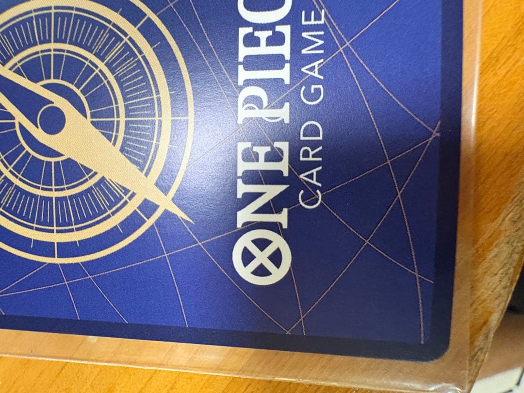 One Piece Card Game Rob Lucci SP OP05-093 rare card stored in a sleeve and folder with visible marks