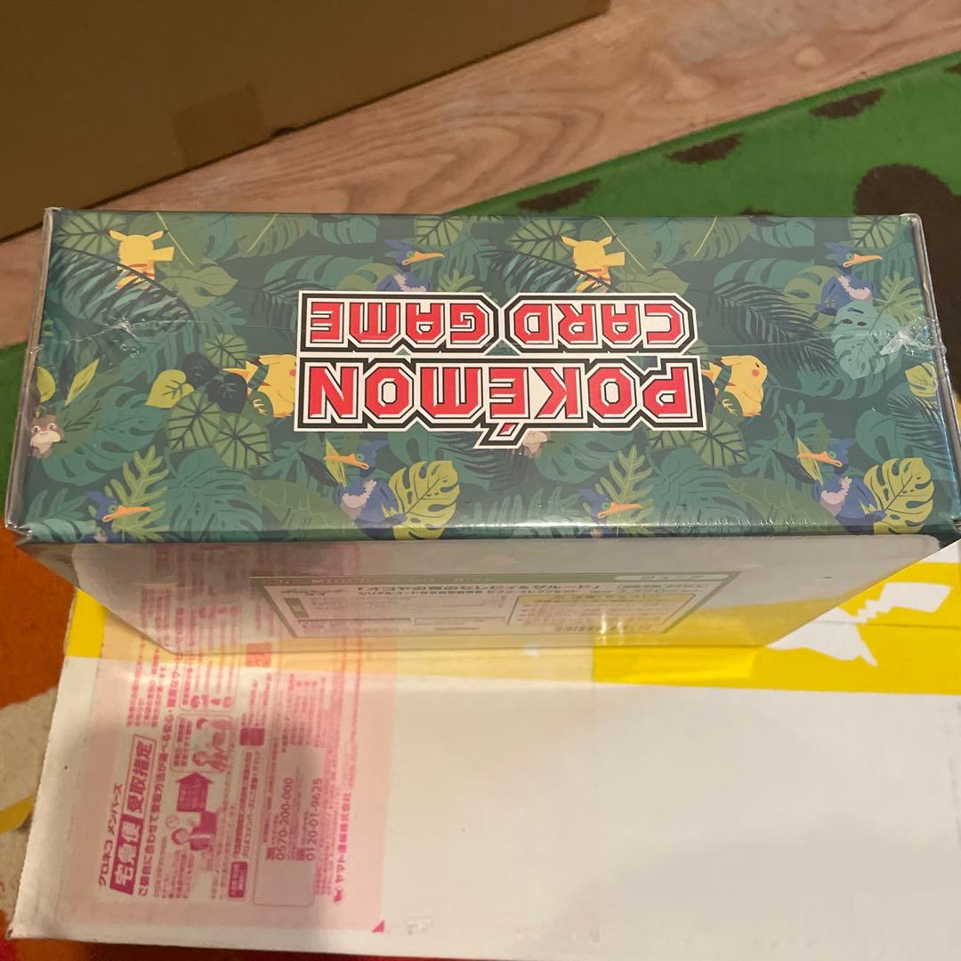 Bandai Pokemon Okoaya Forest Celebi & Zarude 7-Eleven set featuring promo cards, coins, booster packs, and serial code ticket