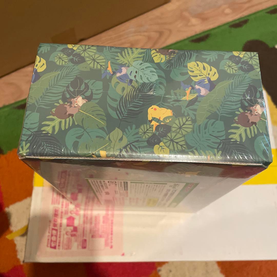 Bandai Pokemon Okoaya Forest Celebi & Zarude 7-Eleven set featuring promo cards, coins, booster packs, and serial code ticket
