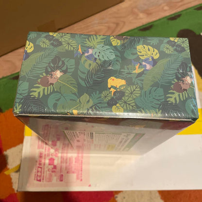 Bandai Pokemon Okoaya Forest Celebi & Zarude 7-Eleven set featuring promo cards, coins, booster packs, and serial code ticket