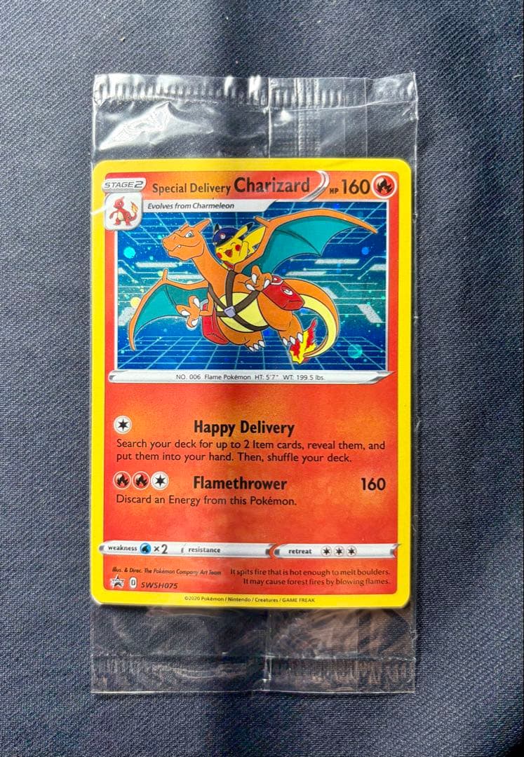 Unopened Pokemon special delivery Charizard promo card SWSH075 sealed in original shield pack from Japan