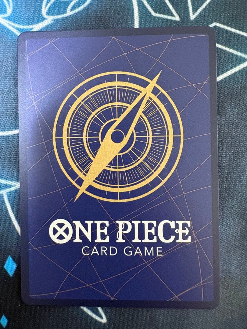 Used One Piece Monkey D. Luffy P-099 collectible card with protective sleeve and cardboard reinforcement