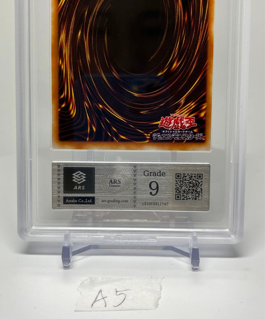 Yugioh Black Magician Girl Ultra Rare P4-01 trading card in protective sleeve with cardboard backing