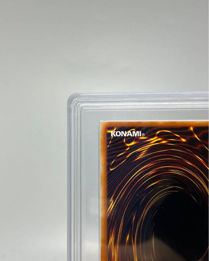 Yugioh Black Magician Girl Ultra Rare P4-01 trading card in protective sleeve with cardboard backing