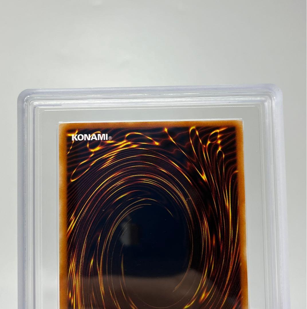 Yugioh Black Magician Girl Ultra Rare P4-01 trading card in protective sleeve with cardboard backing