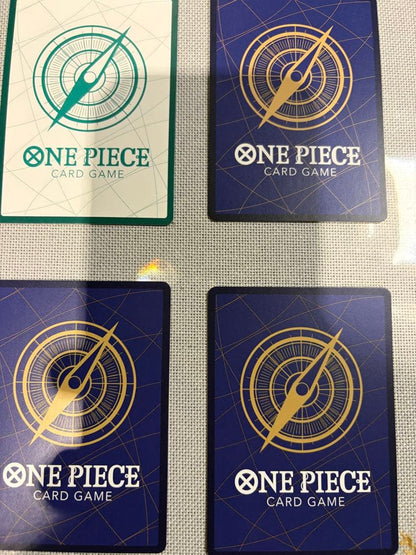 One Piece Card Game 13-card set featuring Monkey D. Luffy SEC and SR cards in protective sleeves
