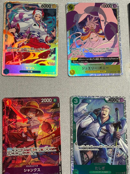 One Piece Card Game 13-card set featuring Monkey D. Luffy SEC and SR cards in protective sleeves