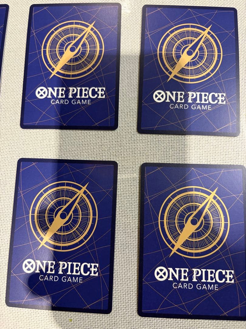 One Piece Card Game 13-card set featuring Monkey D. Luffy SEC and SR cards in protective sleeves