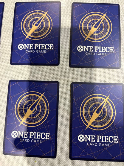 One Piece Card Game 13-card set featuring Monkey D. Luffy SEC and SR cards in protective sleeves