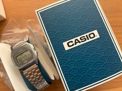 Casio Digital Watch Model A168WE-1 with Wave Pattern Dial and Stainless Steel Band — Japan Import