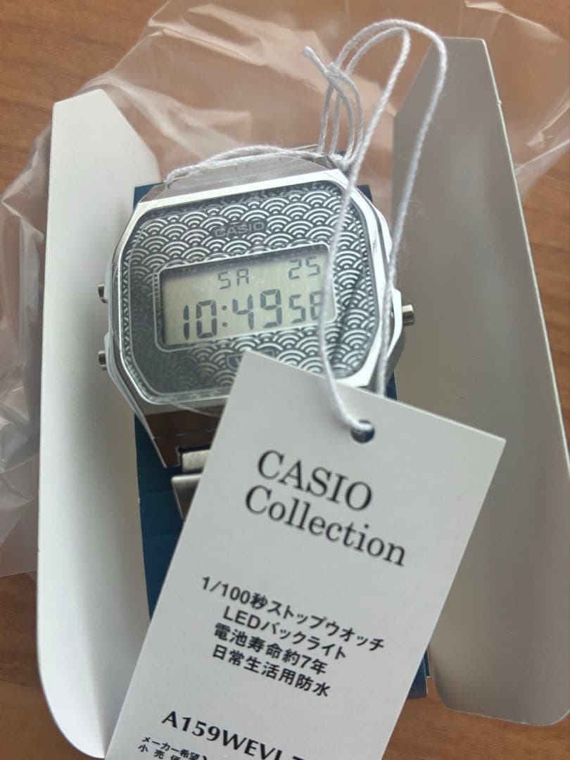 Casio Digital Watch Model A168WE-1 with Wave Pattern Dial and Stainless Steel Band — Japan Import