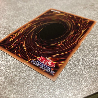 Yu-Gi-Oh White Maiden Quoshik 25th trading card showing front with white scratch on upper right back side