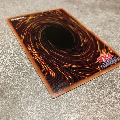 Yu-Gi-Oh White Maiden Quoshik 25th trading card showing front with white scratch on upper right back side